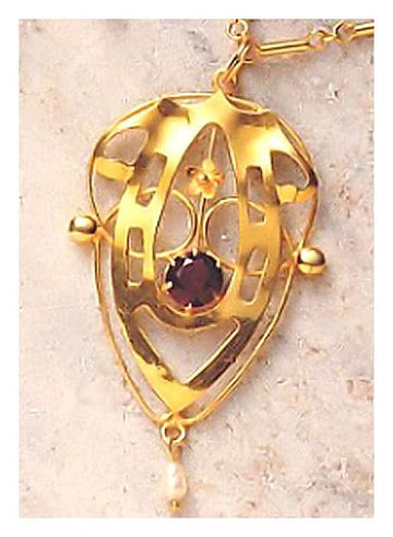 Lyrical Shield Garnet Necklace